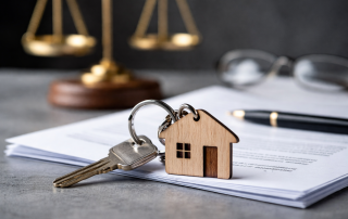 House keys on legal documents with scales of justice representing inherited property and estate matters in Singapore